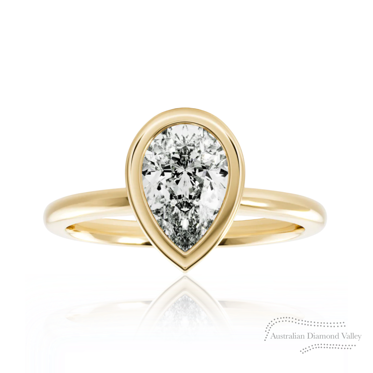 Australian Diamond Valley pear cut bezel setting Gold ring with a pear-shaped diamond on a white background