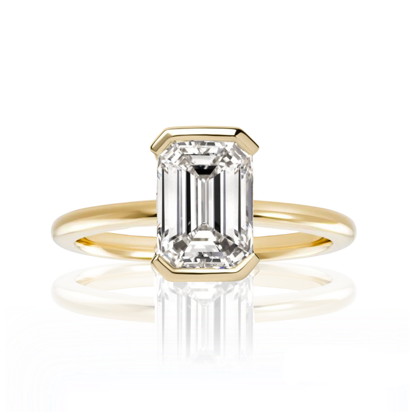 Gold ring with emerald-cut diamond on a white background