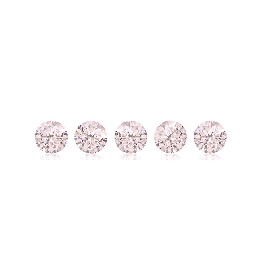 Five pink gemstones arranged in a row on a white background