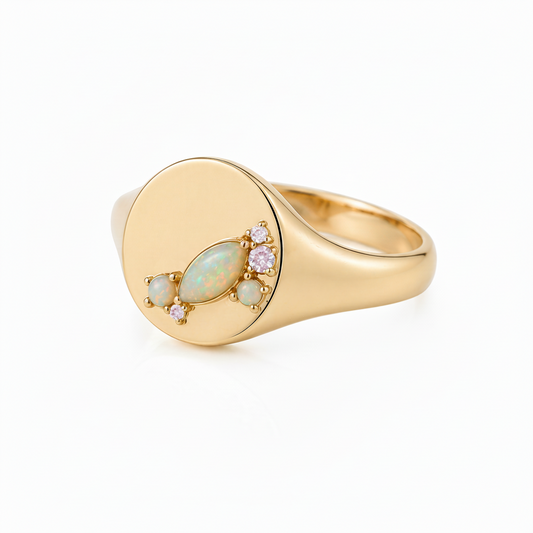 Gold ring with gemstones on a white background