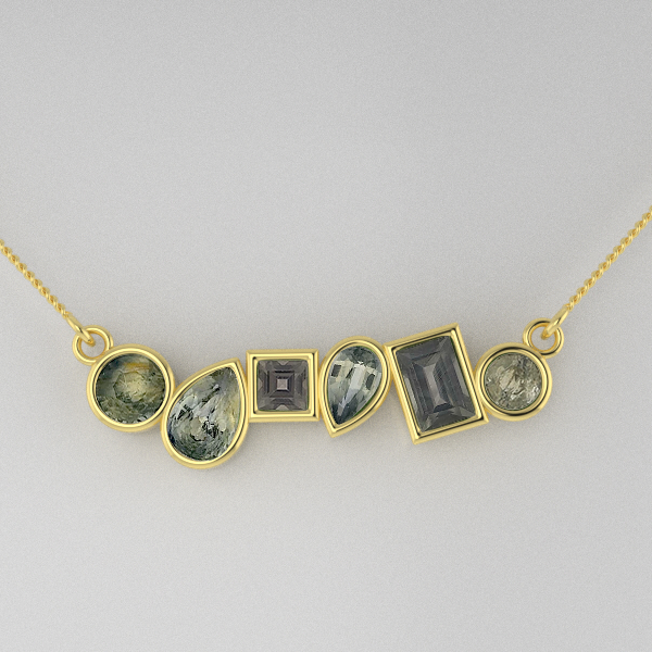 Gold necklace with various gemstones on a light gray background
