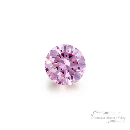 A single pink diamond with a round brilliant cut, presented on a white background, accompanied by a watermark indicating the Australian Diamond Valley.
